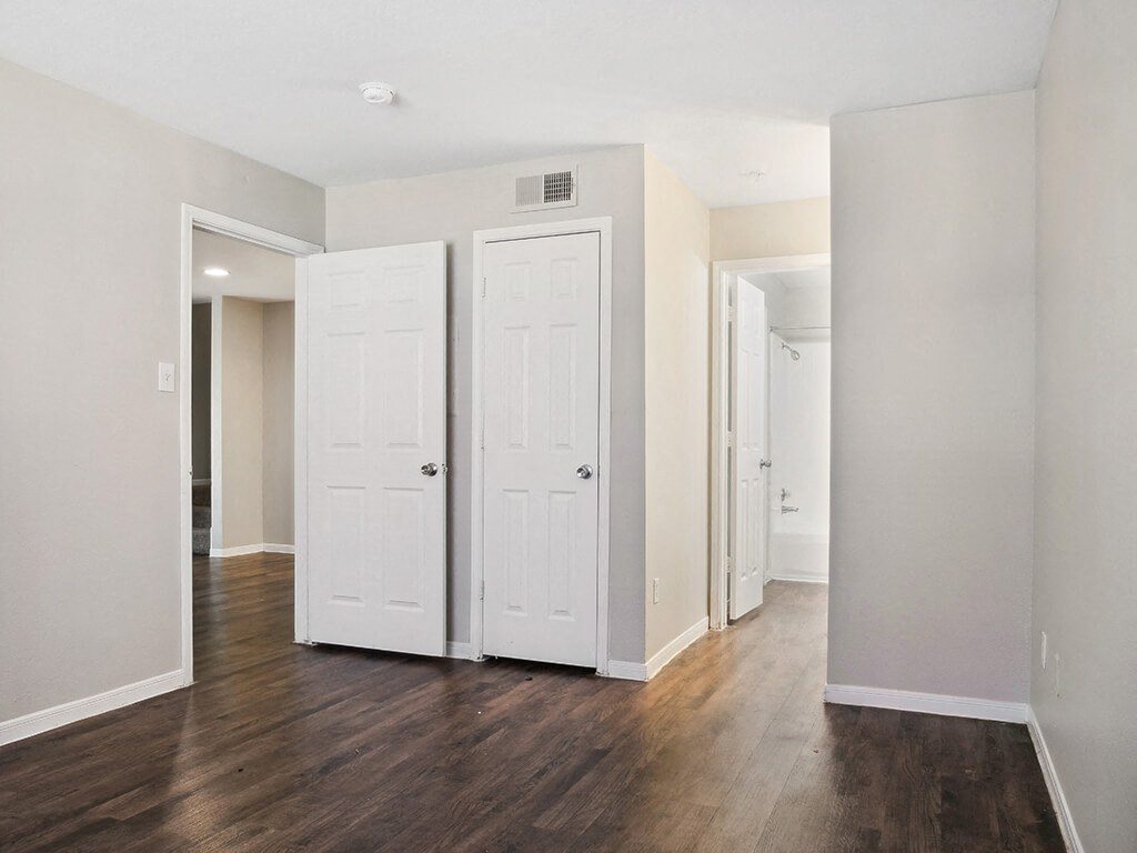 Bedroom with closet at Park Village Apartments in Conroe TX